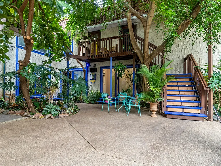 Yellow room is up the steps through room with yellow curtain