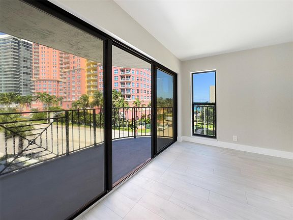 living room with balcony and beach view