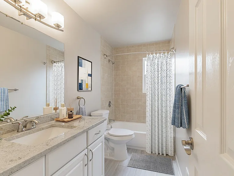 Elevate your daily routine in the stylish bathroom of Eagle Rock Apartments at North Plainfield. Thoughtfully designed with modern fixtures and elegant finishes, this space combines functionality and comfort. Schedule your tour today!