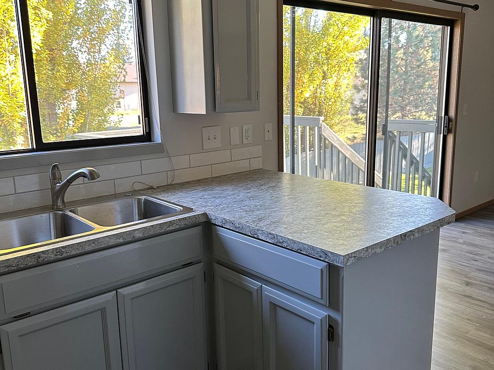 Kitchen with dining area and slider to deck