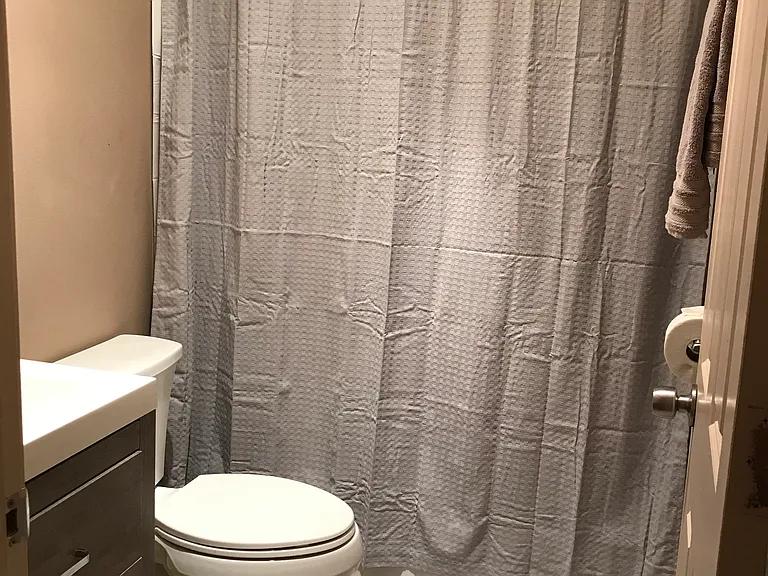 Bathroom with tub. curtain/rug not included