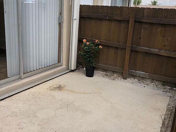 Private fenced / gated backyard. SLiding doors off patio to living room.