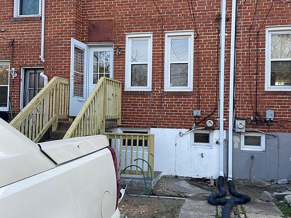 Back of house with parking spot