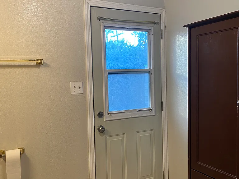 Back door, in bathroom.