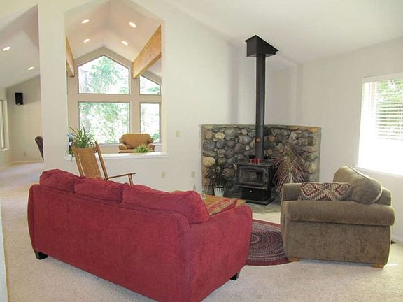 "Inviting family area with compliant woodstove"