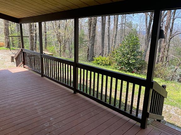 Relax and enjoy distant mountain views on the covered front porch.
