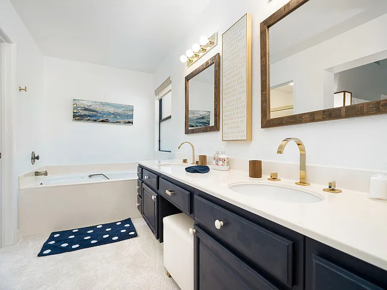 Primary bath with Jacuzzi tub.