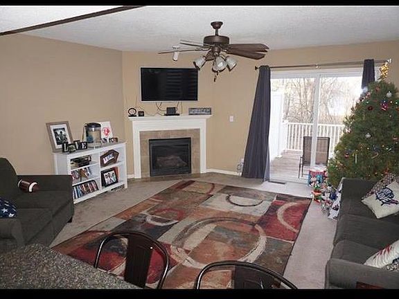 Living space flows from kitchen, breakfast bar into the family room with gas fireplace. Next area- walk out patio deck for your relaxation.