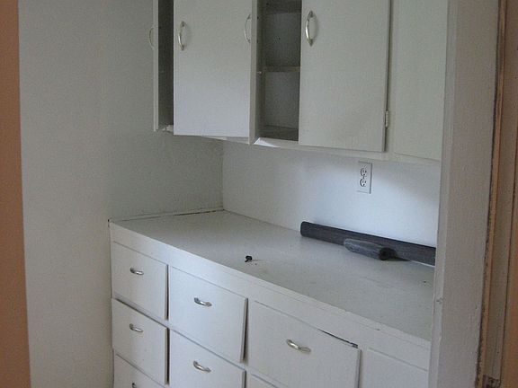 laundry with lots of cabinets