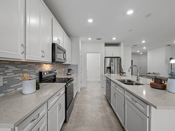 Kitchen with stainless steel appliances and ample storage