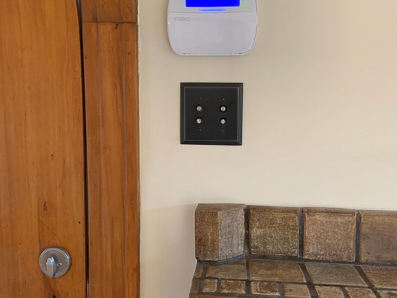 Pushbutton dimmers and alarm system