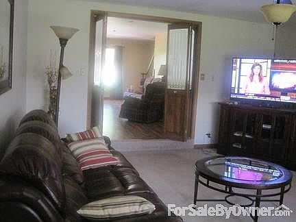 Family Room
						:
						French doors on east wall open to deck. Large bow window faces south.