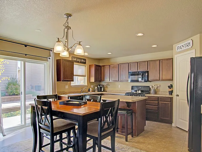 Fully appointed kitchen with gas range, dining area, and everything needed for extended stays.