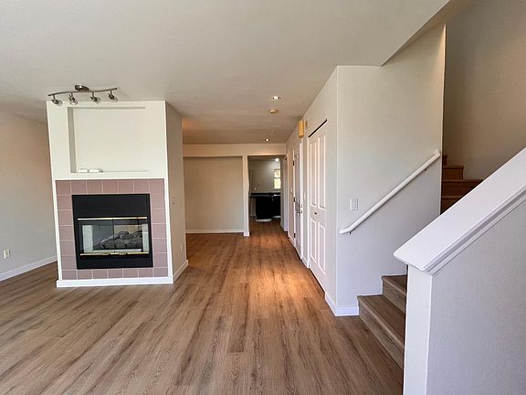 The view from the main door. Two sided fireplace is separating dining room from the living room
