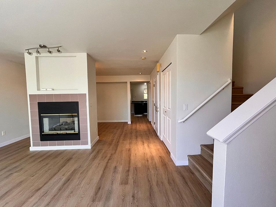 The view from the main door. Two sided fireplace is separating dining room from the living room