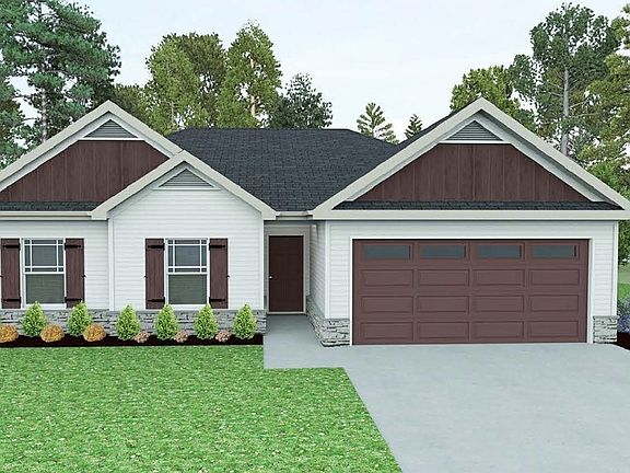 Photo file New three bedroom two bath, two car garage with a covered back porch