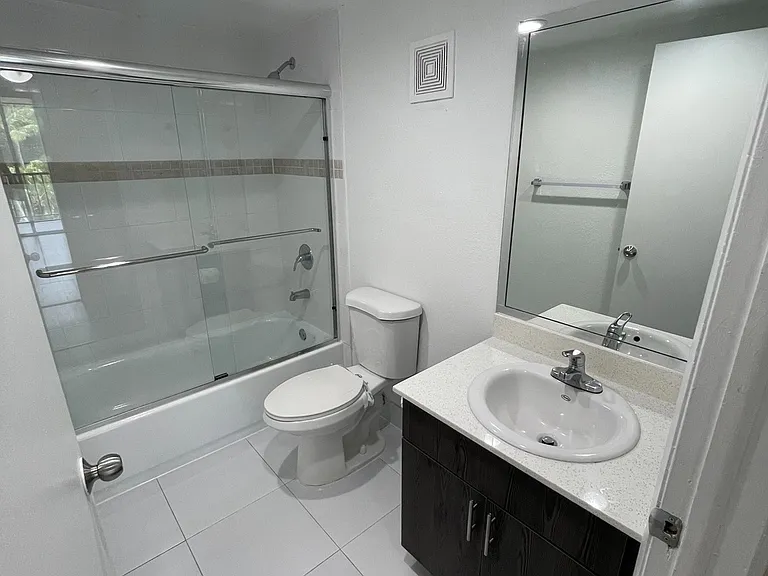 Spacious Bathrooms with Sliding Glass Tub/Shower Doors