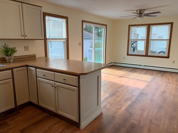 Kitchen & Dining Room - Bright and sunny with plenty of room for dining inside and out on your private deck