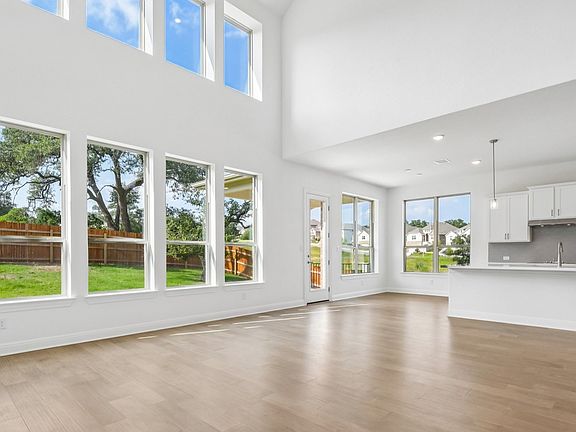 An interior shot of the living room in the Brown floorplan at Retreat at San Gabriel - Representativ
