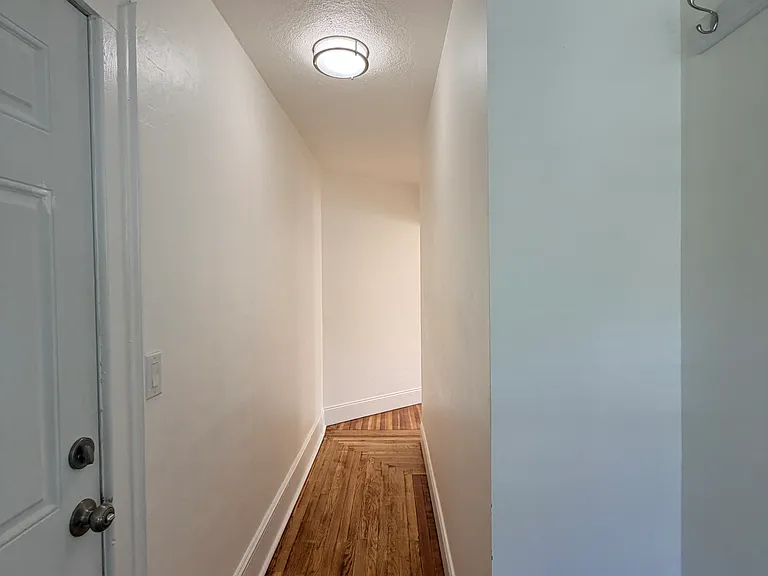 Long entrance hallway when entering into the unit