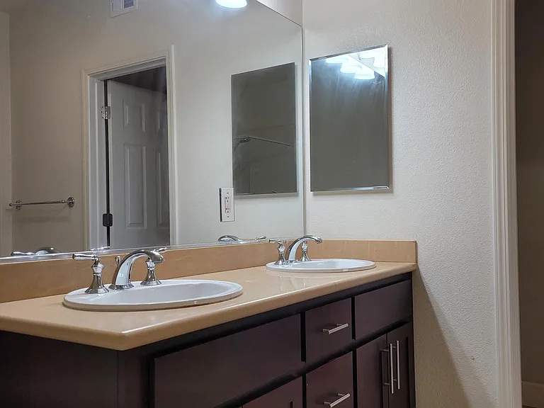 Master Bathroom: dual sinks, private toilet room, jacuzzi-sized bathtub, shower