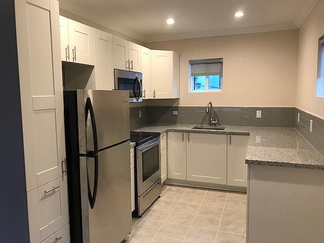 Brand new kitchen with everything; Dishwasher, microwave, disposal, flat top stove, ice-maker & Granite