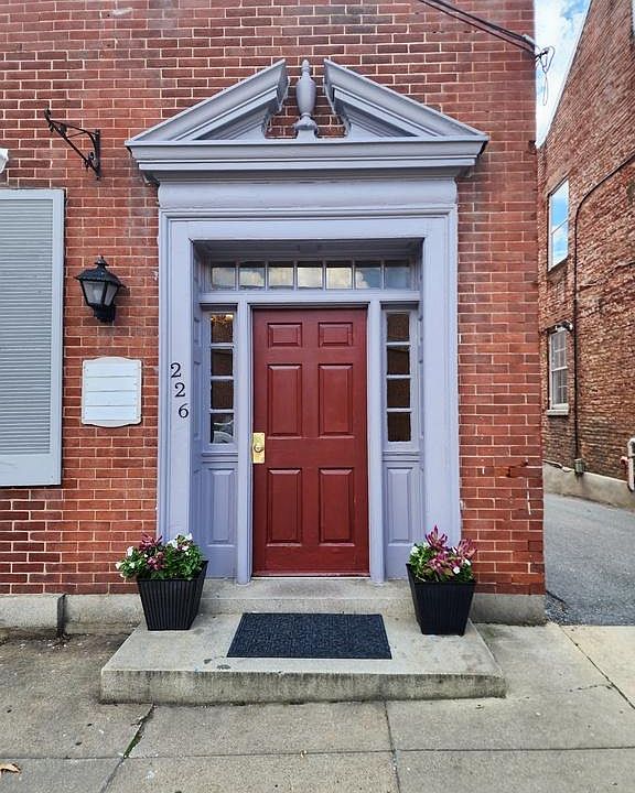 Front door of building, into lobby, freshly painted