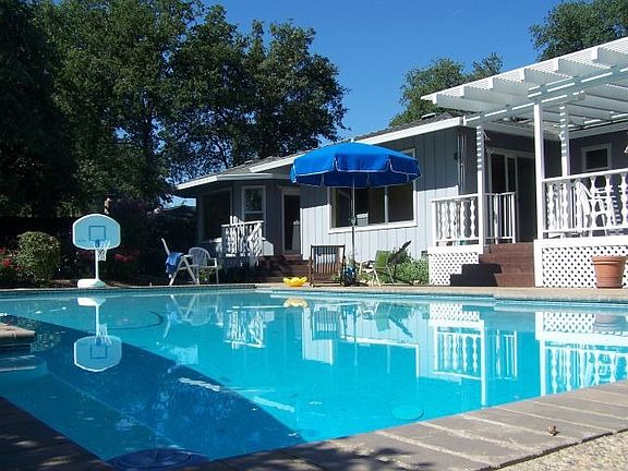 Gunite pool, jaccuzzi, 2 covered redwood decks 