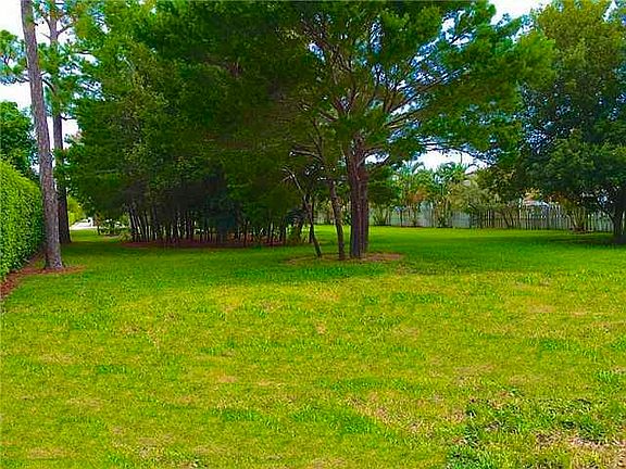 Exterior Front. View from Back to Front. Access is Right of the hedge