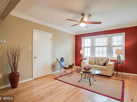 Walk-in-closet and ceiling fan in the living room