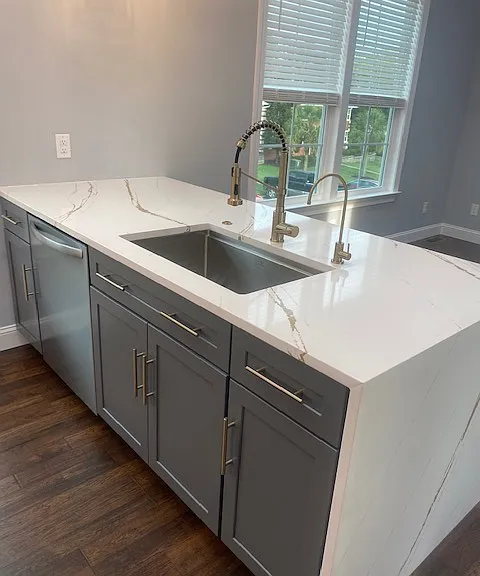Deep sink with luxury faucet.