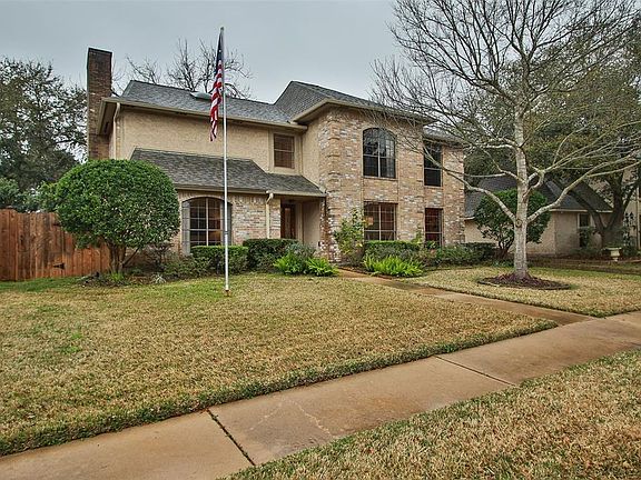 Another view that highlights the generous size of the yard and extensive mature landscaping.