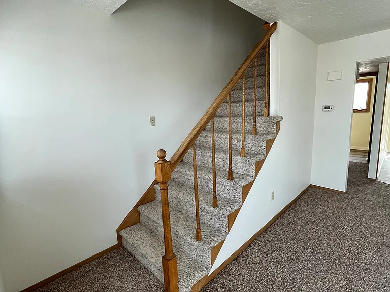 Living Room, Stairs to second level and master bedroom and 2nd Bedroom