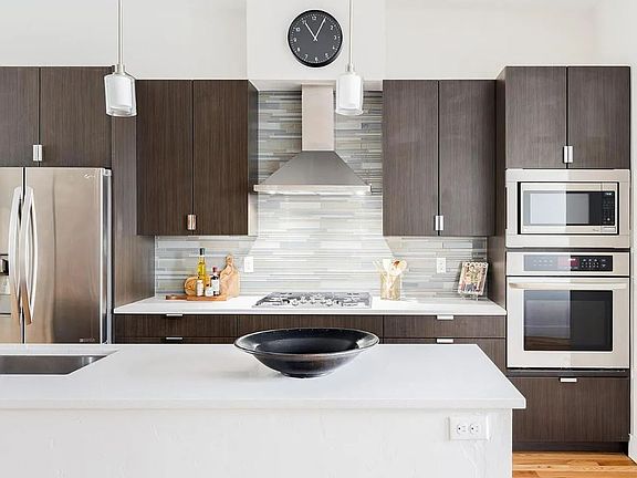 Appliances included: Microwave, Oven, Range Hood, Refrigerator
