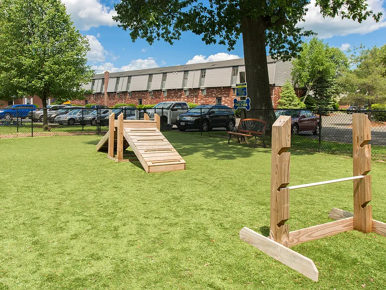 Let your furry friend frolic and make new pals in our dog park, designed with agility equipment and a cozy bench for pet parents.