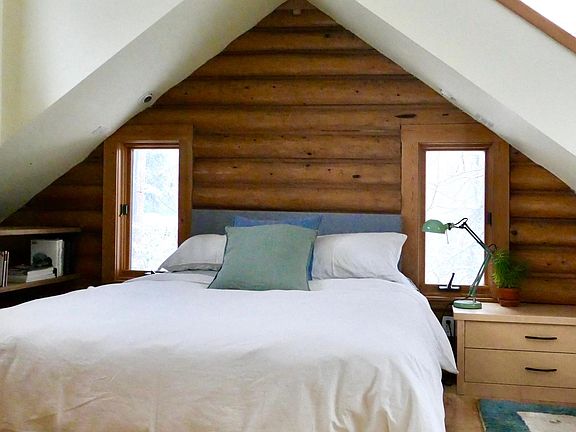 Bed area of SW facing bedroom (with built-in desk). Plenty of built- in storage. Stunning