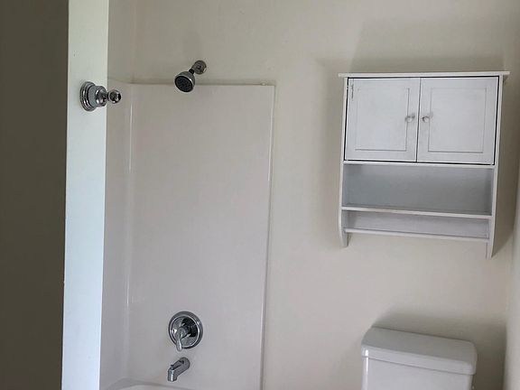 New toilet and floor in bathroom (not shown in this photo)