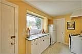 Kitchen, cute, not fancy, gas range, no DW.