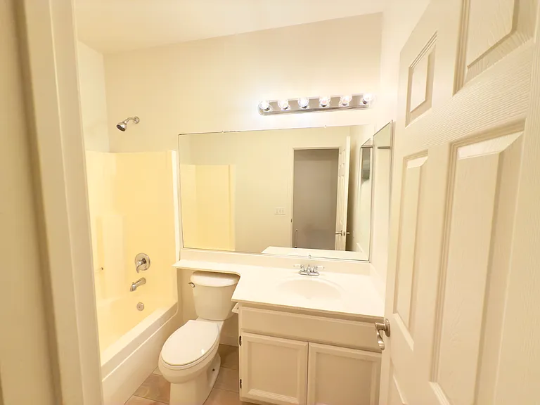Elegant bathrooms featuring updated tile flooring, modern fixtures, and ample space for comfort and functionality!