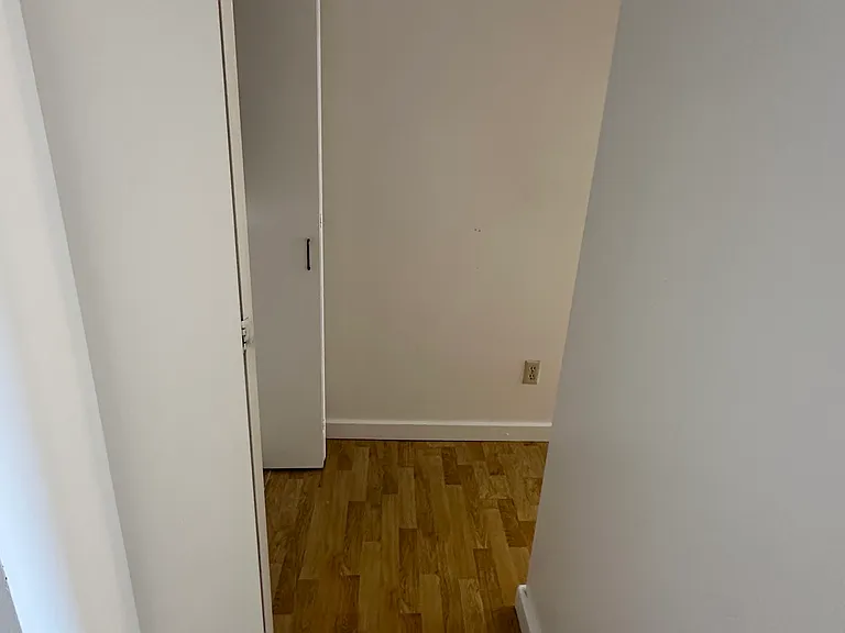 Hallway towards bathroom, washer/dryer, and bedroom