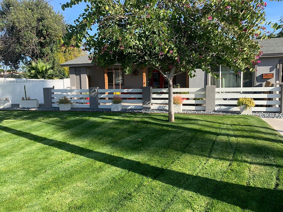 Front of the home w/ gated patio area.
