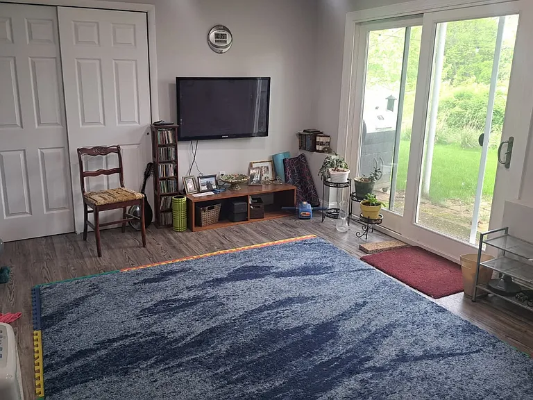Downstairs bonus room (2nd living room) with sliding glass door to back yard.