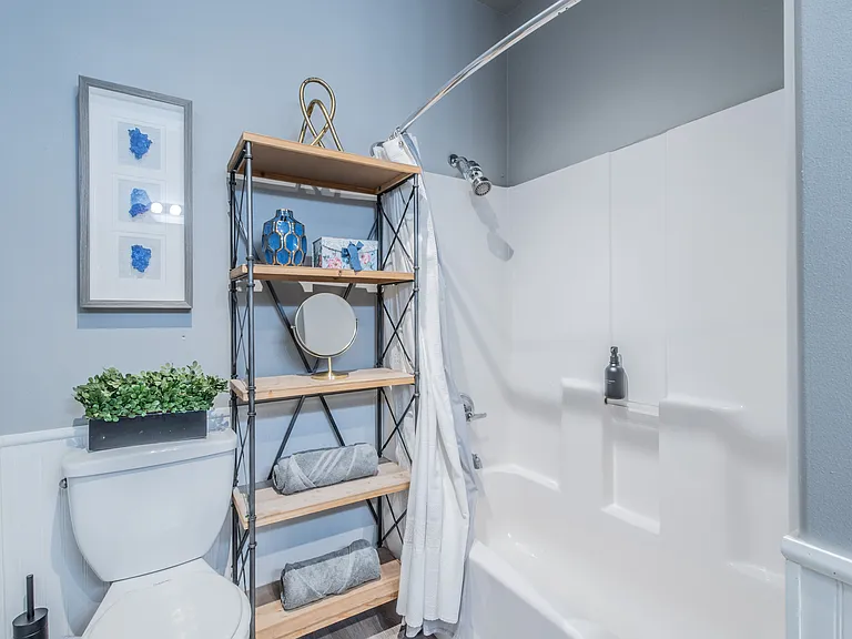 Functional layout with a shower-tub combo and extra storage.