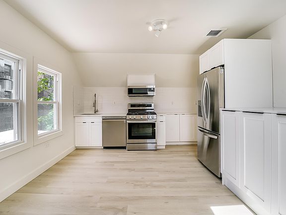 Fully renovated beautiful kitchen/dining with brand new french door fridge, dishwasher, gas stove/airfryer oven, microwave and laundry