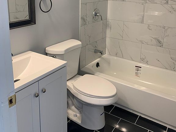 Updated Bathroom, Granite Flooring and Ceramic Tile