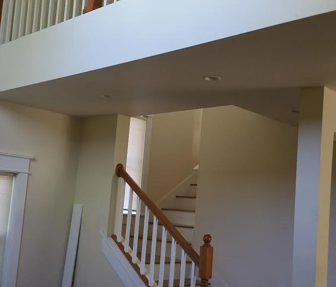 Living room has 20' vaulted ceilings with sitting area over
