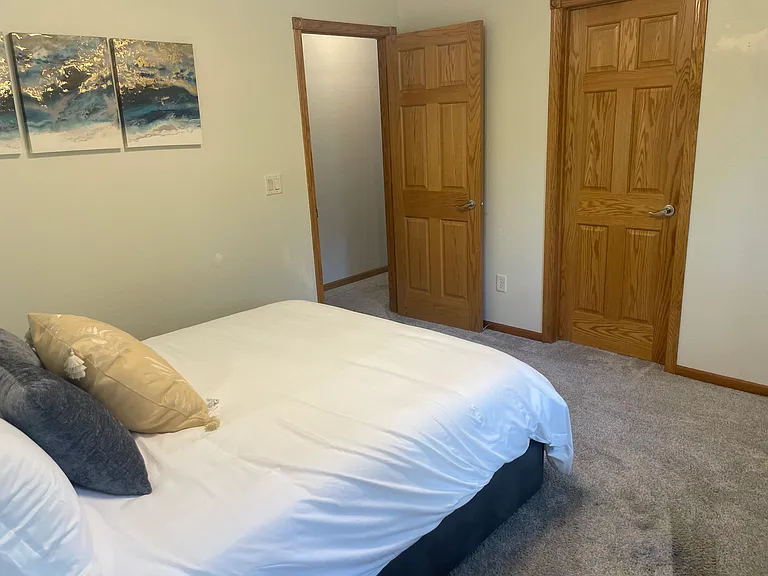 Door to hallway (open) and other door is to the bathroom.