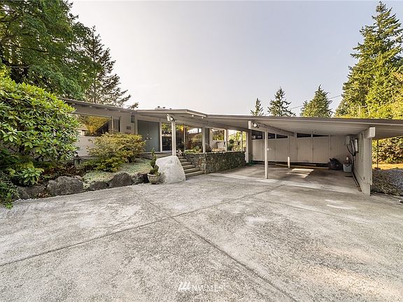 Circular driveway and two car carport