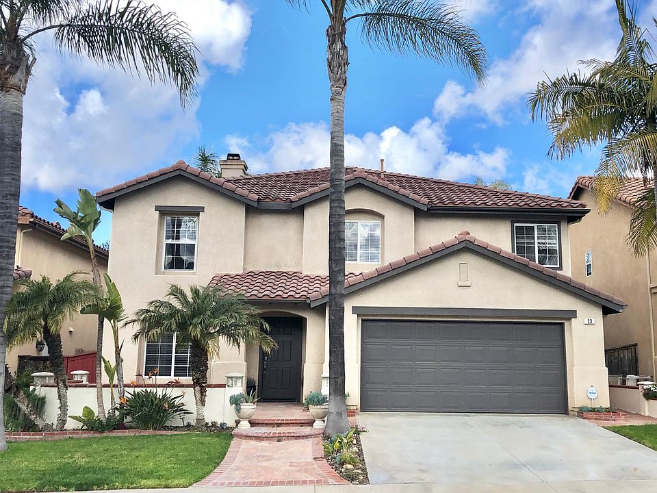 Mediterranean Living - great curb appeal with two car garage.