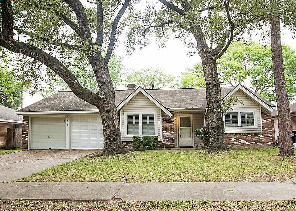 Welcome to 7530 Troulon Dr, surrounded by beautiful mature trees located in a quiet neighborhood con